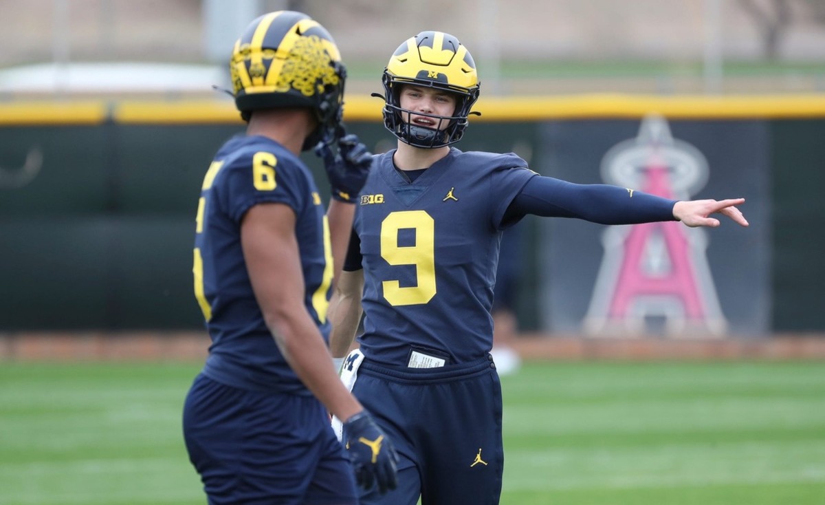 Michigan quarterback J.J. McCarthy talks to wide receiver Cornelius Johnson during a practice on Thursday before Saturday's playoff game against TCU. (Kirthmon F. Dozier/USA TODAY Sports)