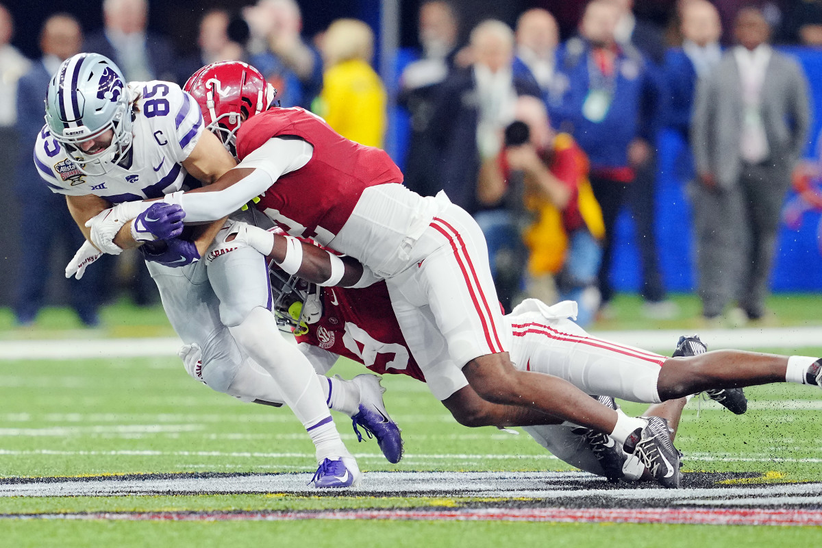 Kansas State Wildcats wide receiver Kade Warner (85) is brought down by Alabama Crimson Tide defensive back DeMarcco Hellams (2) during the first half in the 2022 Sugar Bowl at Caesars Superdome.