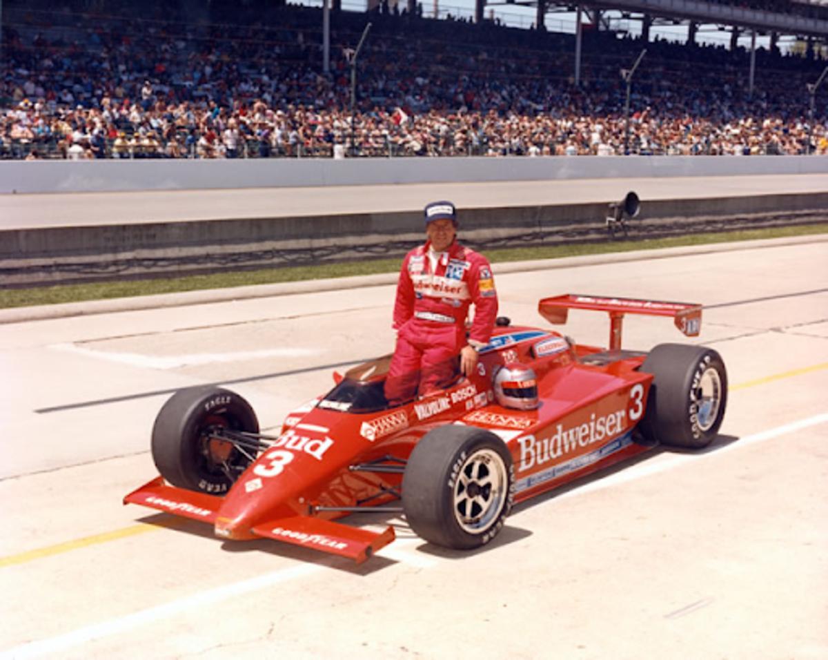 Mario Andretti in what would become the iconic all-red Budweiser livery, pictured here at the 1984 Indianapolis 500. Photo courtesy: Indianapolis Motor Speedway