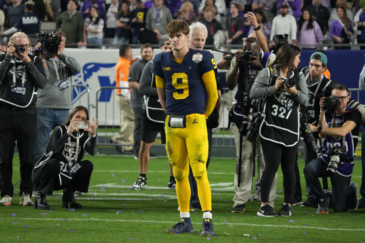 J.J. McCarthy watches TCU celebrate its win in the Fiesta Bowl.