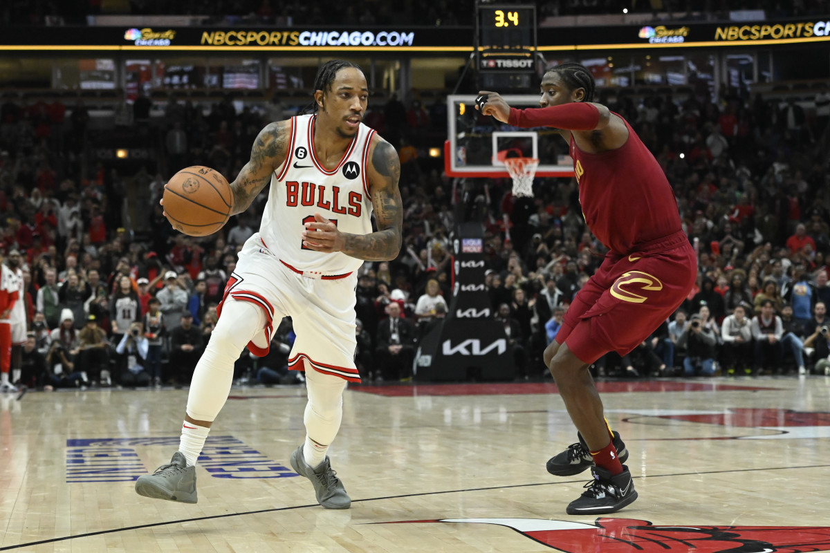 Chicago Bulls forward DeMar DeRozan dribbles the ball against Cleveland Cavaliers guard Caris LeVert