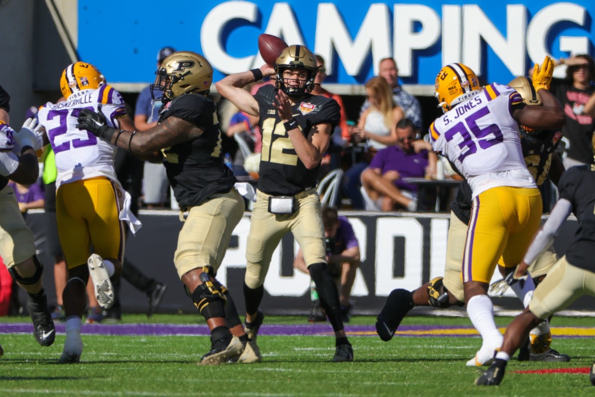 Purdue Boilermakers quarterback Austin Burton (12) throws a pass during the second quarter against the LSU Tigers at Camping World Stadium.