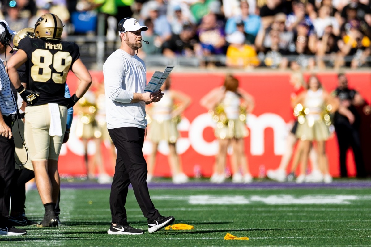 Purdue Boilermakers interim head coach Brian Brohm waits for the penalty call during the first half against the LSU Tigers at Camping World Stadium.