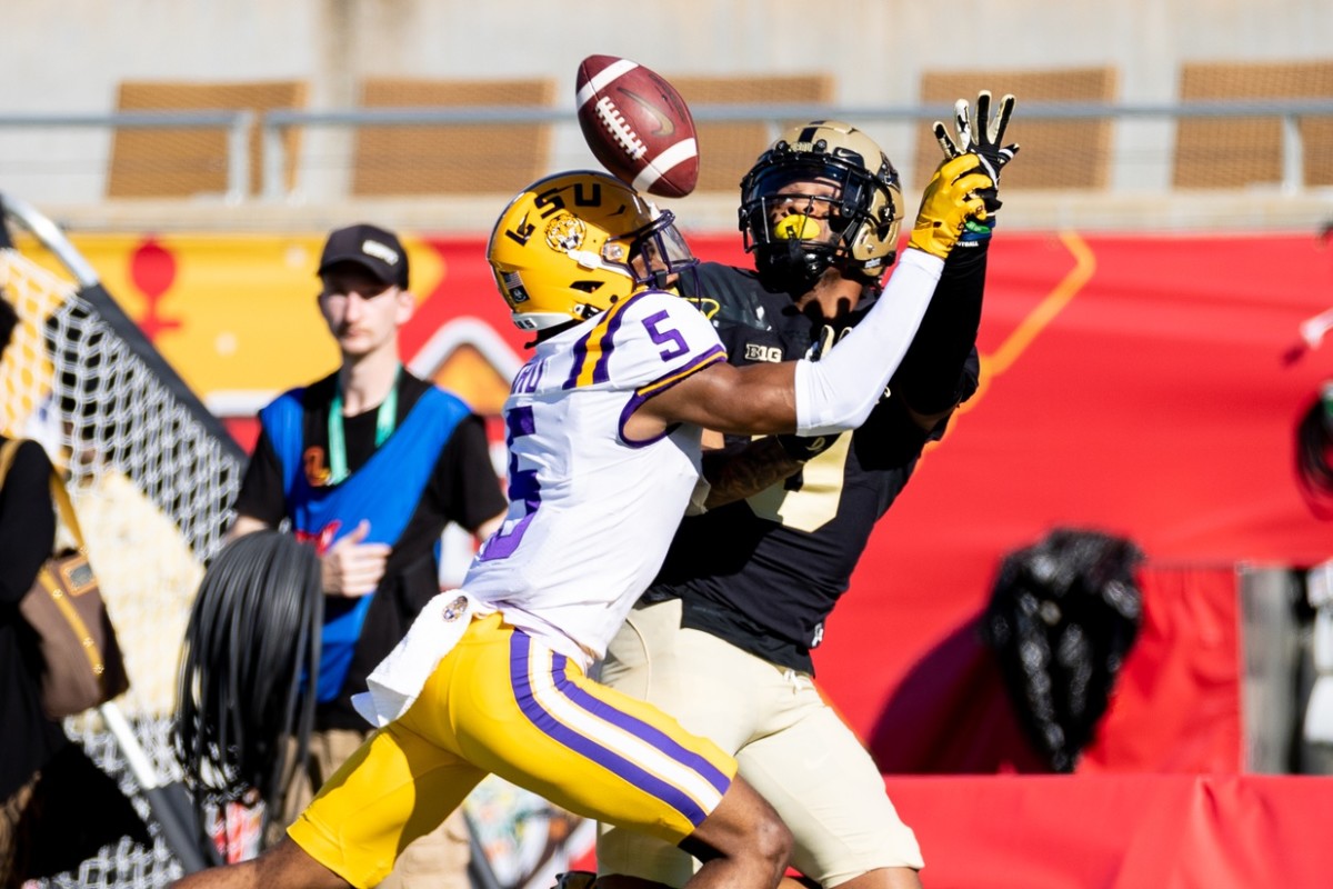 LSU Tigers safety Jay Ward (5) breaks up a pass to Purdue Boilermakers wide receiver Mershawn Rice (9) during the first half at Camping World Stadium.
