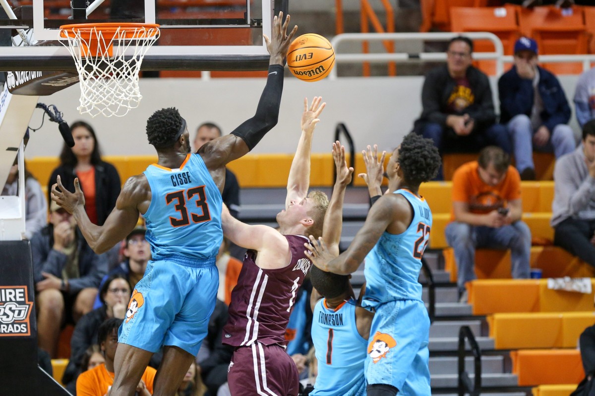 Oklahoma State forward Moussa Cisse (33) blocks a shot by Southern Illinois forward Marcus Domask (1) in the second half during a college basketball game between the Oklahoma State Cowboys (OSU) and the Southern Illinois Salukis at Gallagher-Iba Arena in Stillwater, Okla., Thursday, Nov. 10, 2022