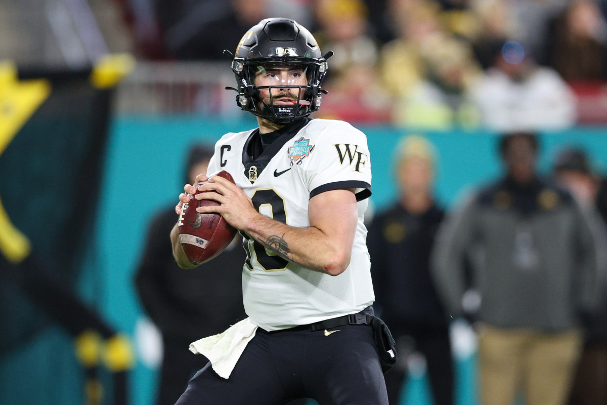 Tampa, Florida, USA; Wake Forest Demon Deacons quarterback Sam Hartman (10) drops back to pass against the Missouri Tigers in the first quarter in the 2022 Gasparilla Bowl at Raymond James Stadium