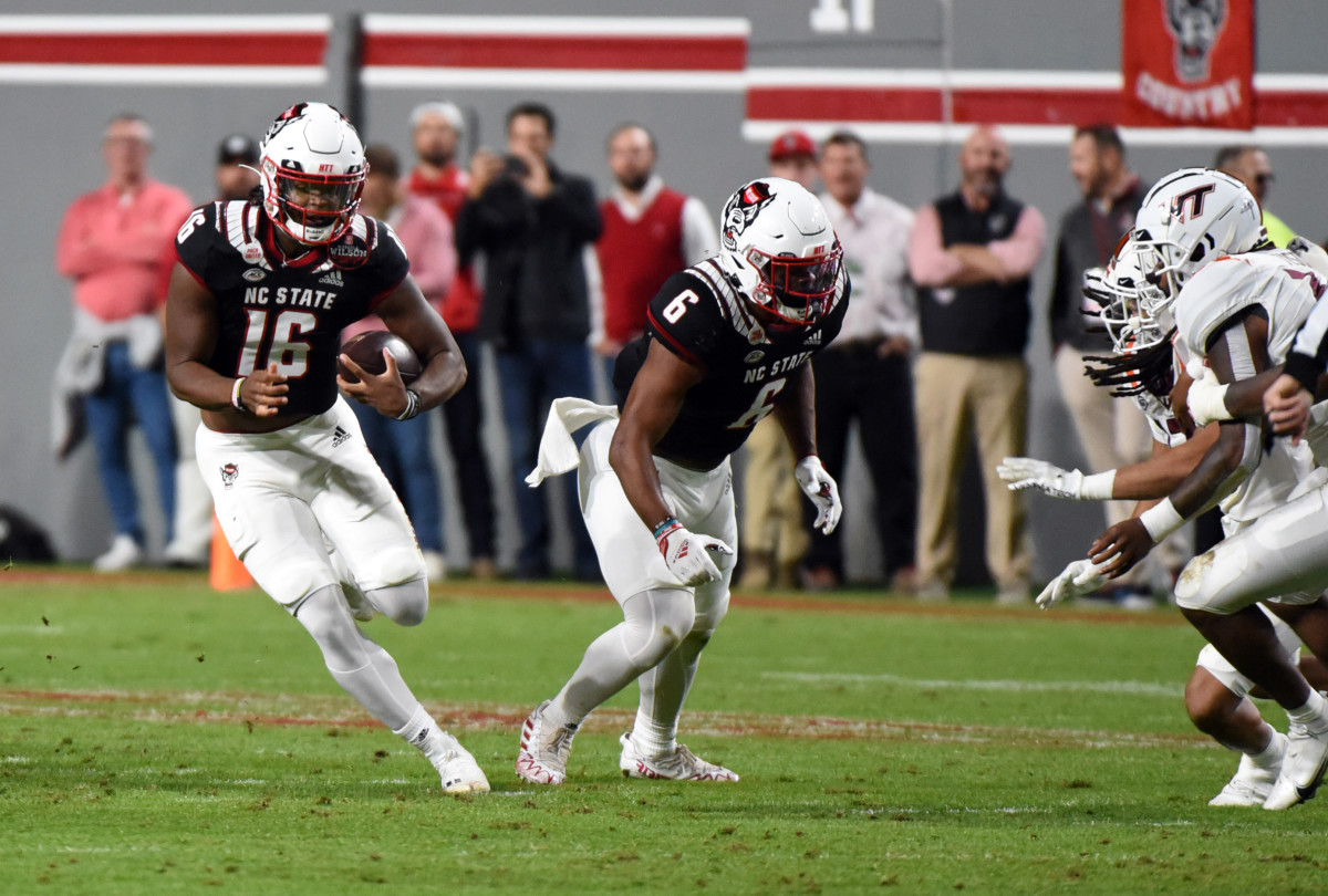 NC State quarterback M.J. Morris runs the ball against Virginia Tech in the Wolfpack's, 25-24, home win on October 27, 2022.