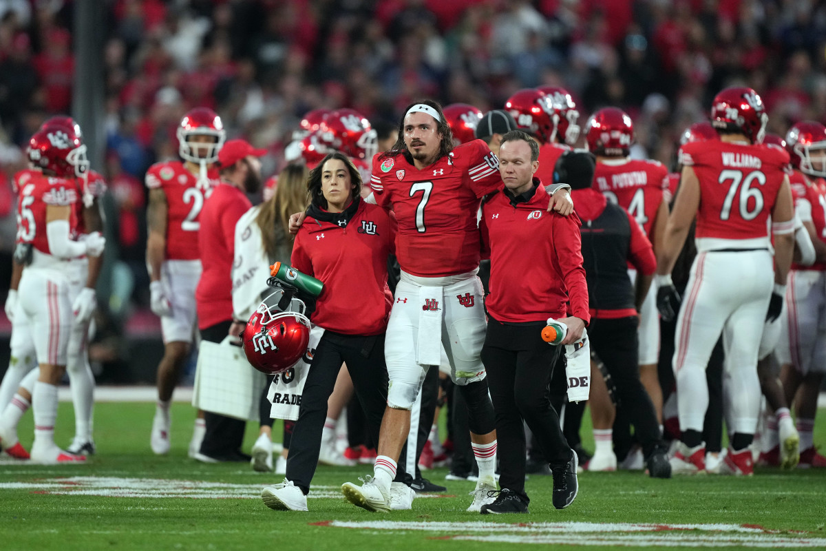 Utah Utes quarterback Cameron Rising (7) walks with assistance off the field in the second half against the Penn State Nittany Lions of the 109th Rose Bowl game at the Rose Bowl.