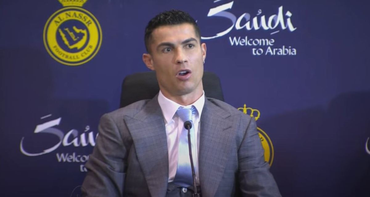 Cristiano Ronaldo pictured speaking to the media after signing for Al Nassr