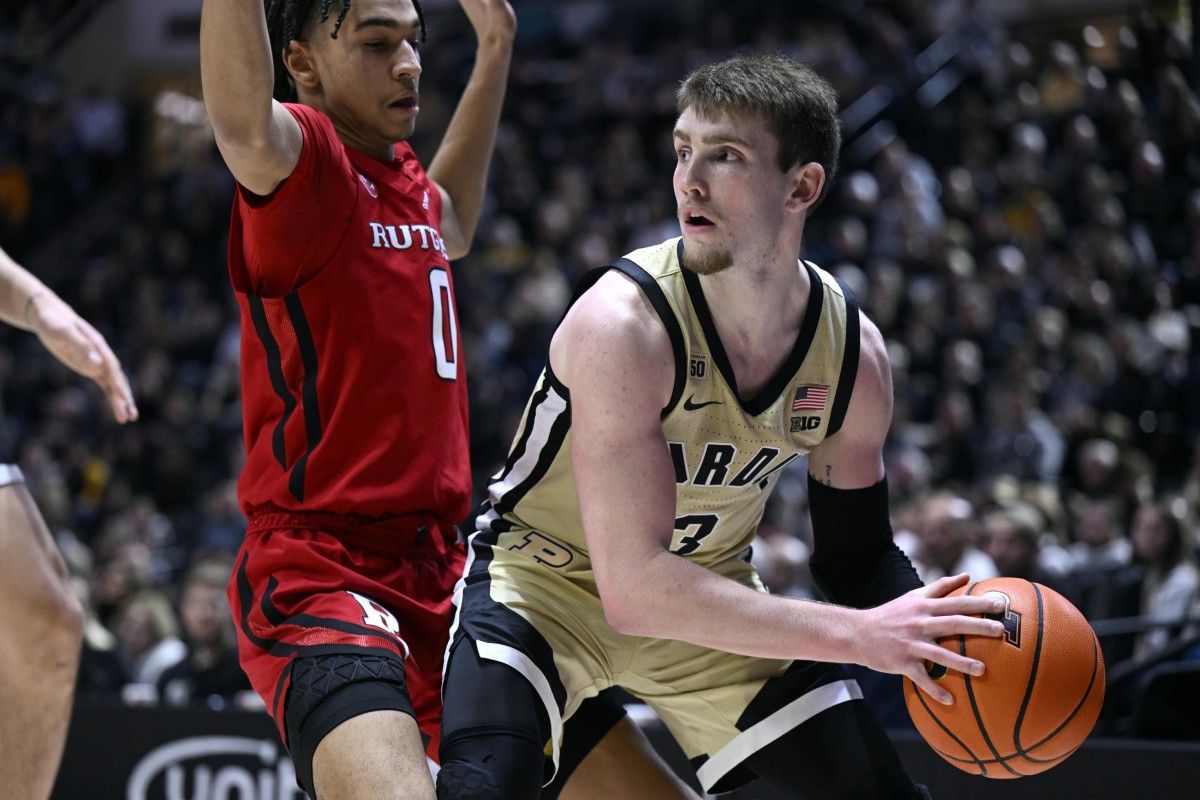 Jan 2, 2023; West Lafayette, Indiana, USA; Purdue Boilermakers guard Braden Smith (3) looks for an open teammate around Rutgers Scarlet Knights guard Derek Simpson (0) during the second half at Mackey Arena.