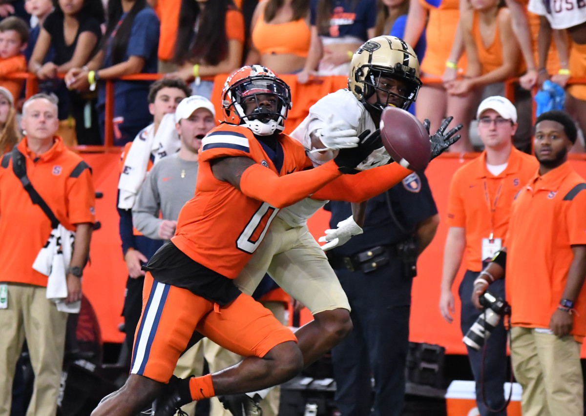 Syracuse, New York, USA; Purdue Boilermakers wide receiver TJ Sheffield (8) has a pass broken up by Syracuse Orange defensive back Darian Chestnut (0) in the fourth quarter at JMA Wireless Dome.