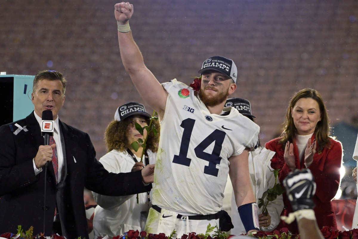 Penn State quarterback Sean Clifford (14) celebrates on the podium after defeating Utah in the 109th Rose Bowl game. (Jayne Kamin-Oncea-USA TODAY Sports)