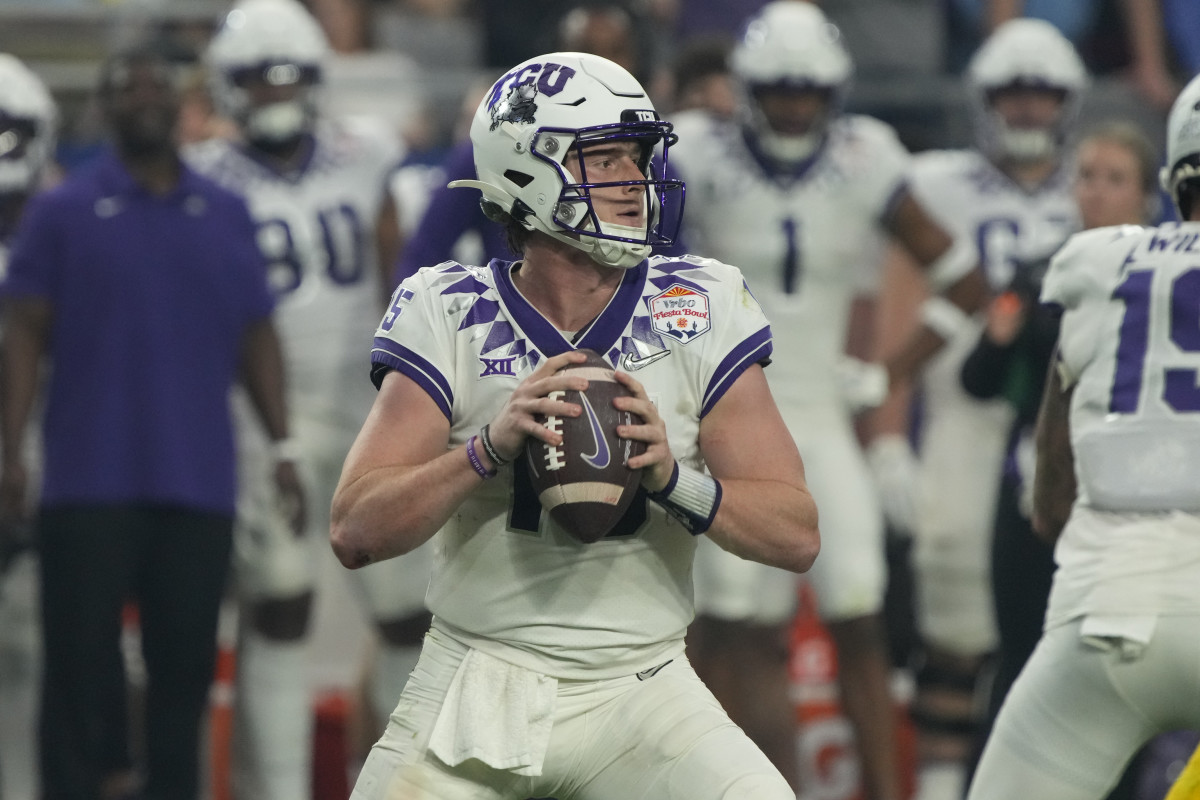 TCU quarterback Max Duggan (15) during the first half of the Fiesta Bowl NCAA college football semifinal playoff game against Michigan, Saturday, Dec. 31, 2022, in Glendale, Arizona. (AP Photo/Rick Scuteri)