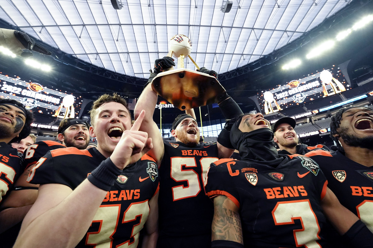 Las Vegas, NV, USA; The Oregon State Beavers celebrate with the Las Vegas Bowl trophy after defeating the Florida Gators 30-3 at Allegiant Stadium.