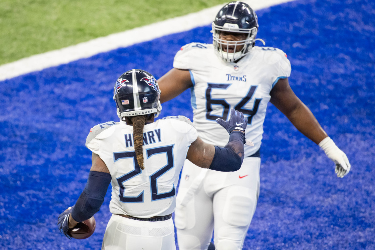 Nov 29, 2020; Indianapolis, Indiana, USA; Tennessee Titans running back Derrick Henry (22) celebrates his touchdown with offensive guard Nate Davis (64) against the Indianapolis Colts in the first half at Lucas Oil Stadium.