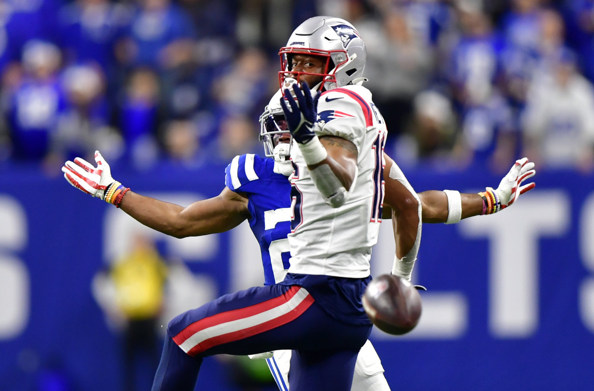 Dec 18, 2021; Indianapolis, Indiana, USA; New England Patriots wide receiver Jakobi Meyers (16) misses a pass under coverage from Indianapolis Colts cornerback Kenny Moore II (23) during the second half at Lucas Oil Stadium. Colts won 27-17.