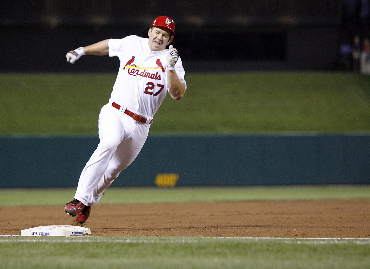 Cardinals third baseman Scott Rolen rounds third base on his way to an inside the park two-run home run against the Cubs at Busch Stadium on Aug 27, 2006.
