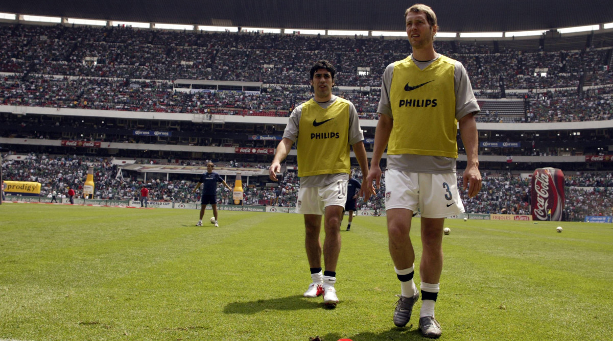 Gregg Berhalter and Claudio Reyna playing for the USMNT.