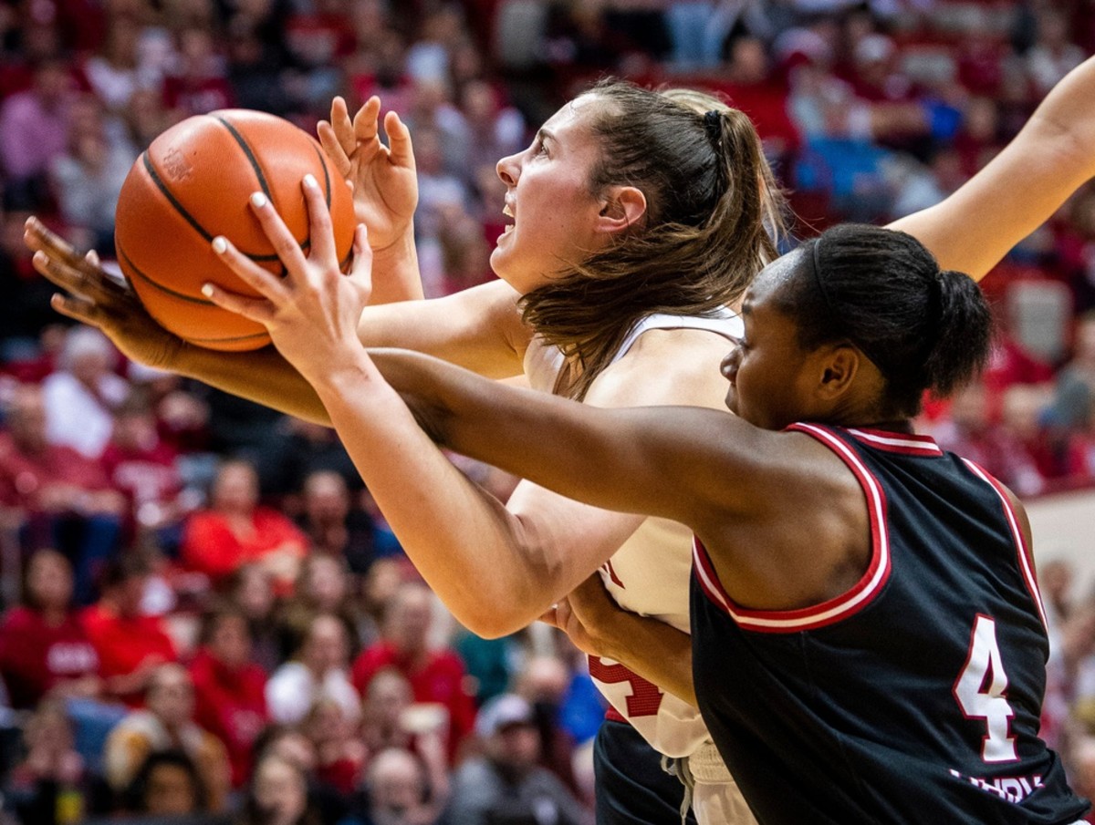 Indiana's Mackenzie Holmes (54) is fouled by Nebraska's Sam Haiby (4) during the second half of the Indiana versus Nebraska women's basketball game at Simon Skjodt Assembly Hall on Sunday, Jan. 1, 2023.