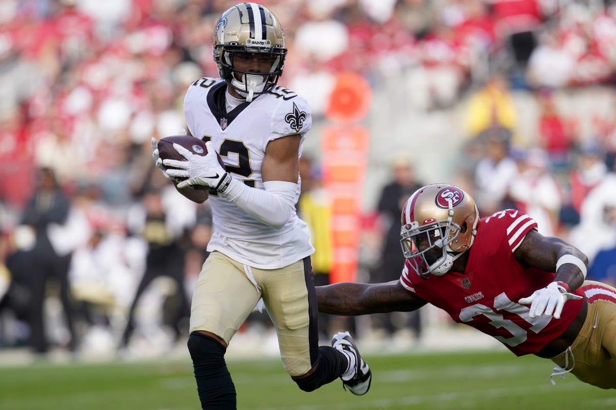 New Orleans Saints wide receiver Chris Olave (12) runs after a catch against the San Francisco 49ers. Mandatory Credit: Cary Edmondson-USA TODAY