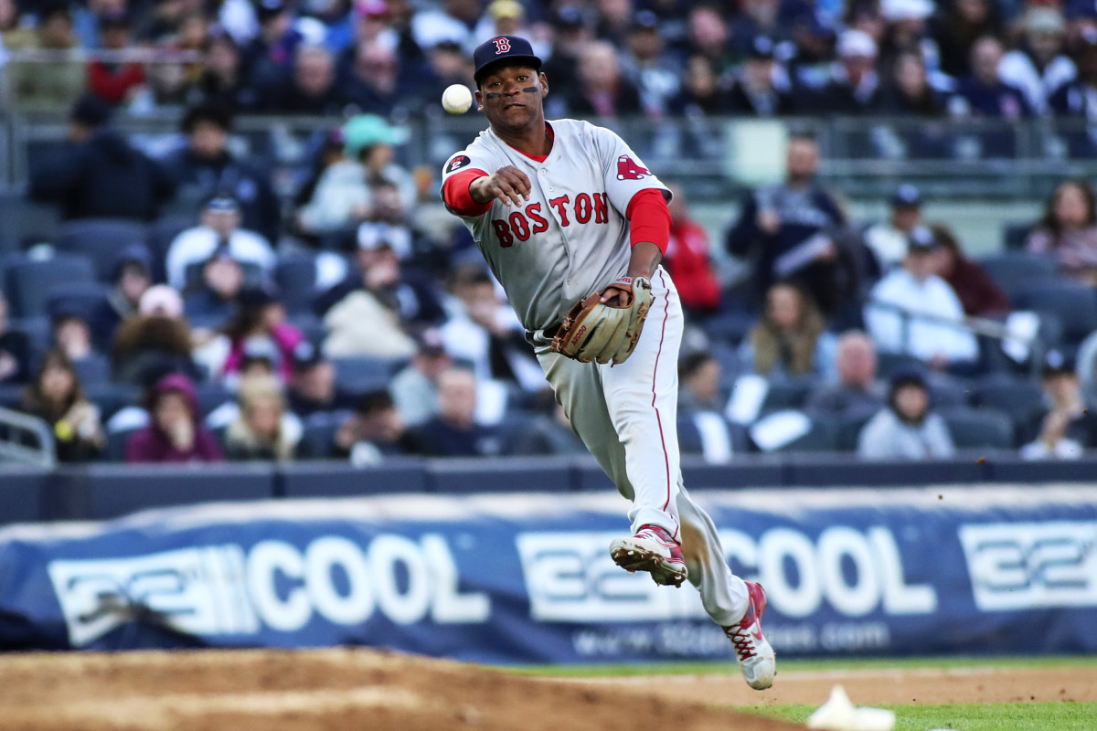 Red Sox third baseman Rafael Devers makes a running throw to first base in the seventh inning against the Yankees at Yankee Stadium on April 9, 2022