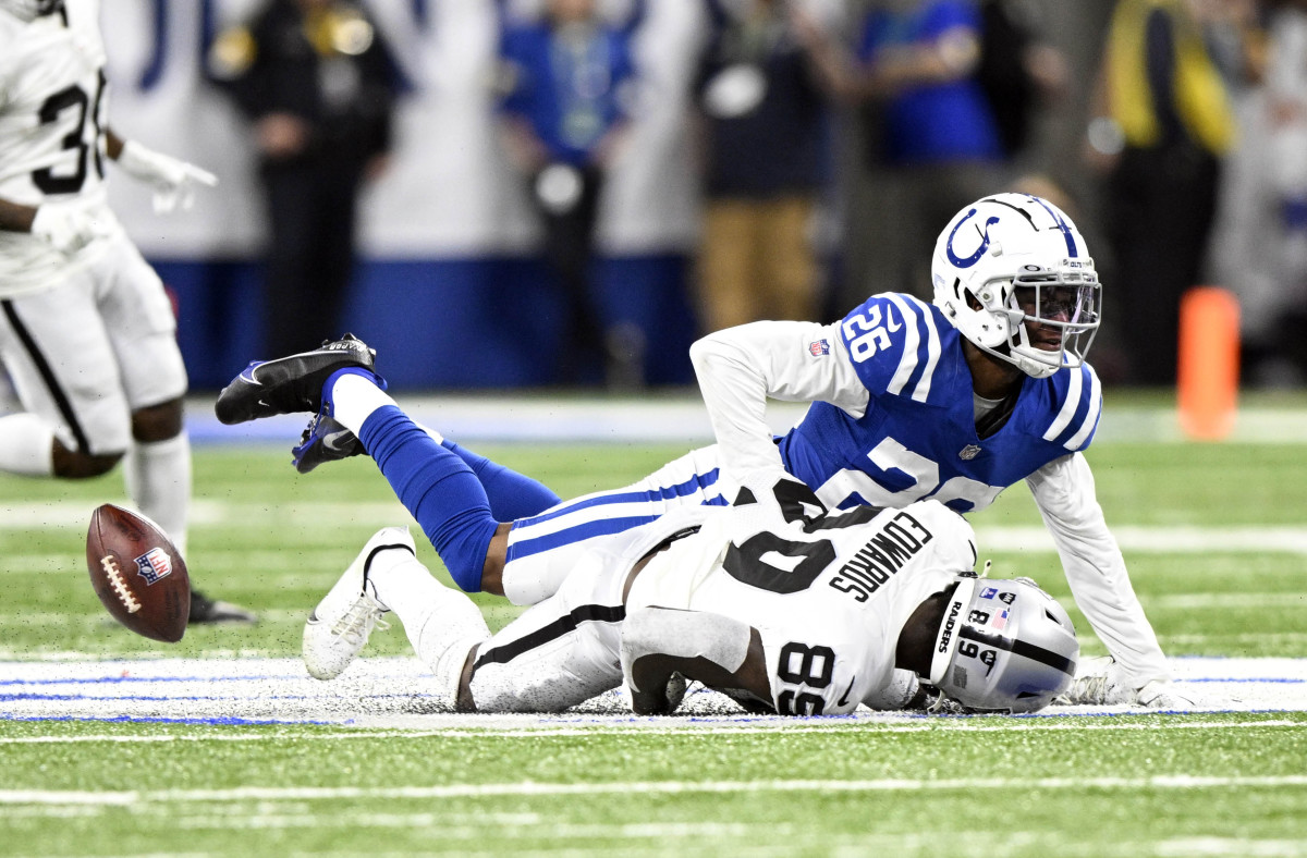 Jan 2, 2022; Indianapolis, Indiana, USA; Las Vegas Raiders wide receiver Bryan Edwards (89) misses a pass under coverage from Indianapolis Colts cornerback Rock Ya-Sin (26) during the second half at Lucas Oil Stadium. Raiders won 23-20.