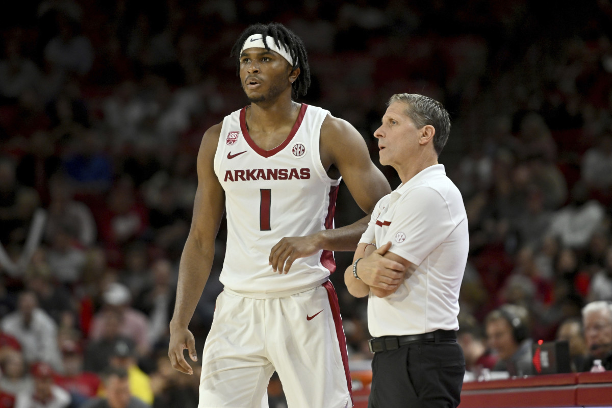 Arkansas coach Eric Musselman talks to Ricky Council IV (1) as they play Troy during the second half of an NCAA college basketball game Monday, Nov. 28, 2022, in Fayetteville, Ark. (AP Photo/Michael Woods