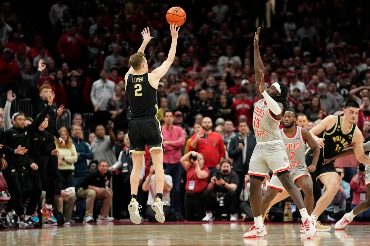 Jan 5, 2023; Columbus, OH, USA; Purdue Boilermakers guard Fletcher Loyer (2) hits the game-winning three pointer over Ohio State Buckeyes guard Isaac Likekele (13) during the second half of the NCAA men's basketball game at Value City Arena. Purdue won 71-69.
