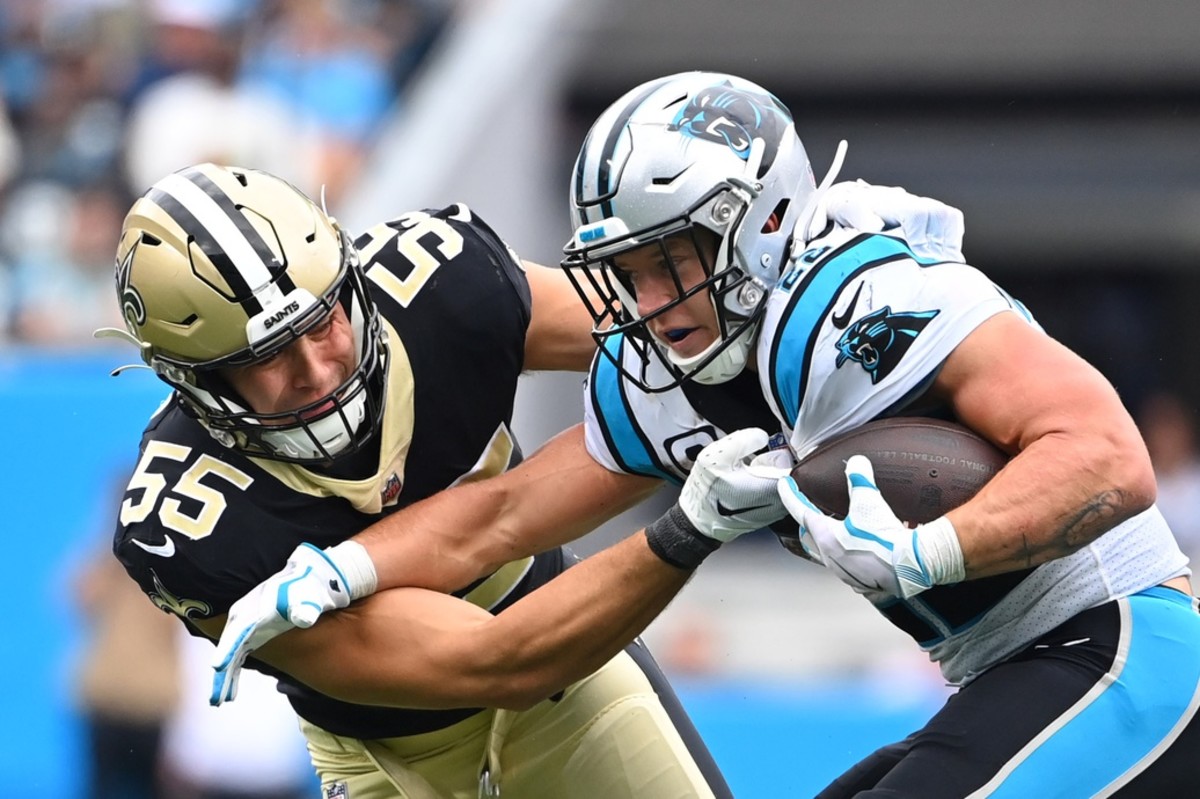 New Orleans Saints linebacker Kaden Elliss (55) tackles former Carolina Panthers running back Christian McCaffrey (22). Mandatory Credit: Bob Donnan-USA TODAY Sports