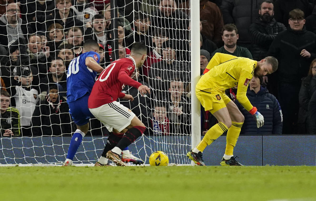 Conor Coady pictured (left) moments before scoring for Everton against Manchester United in January 2023 following an error by David de Gea (right)