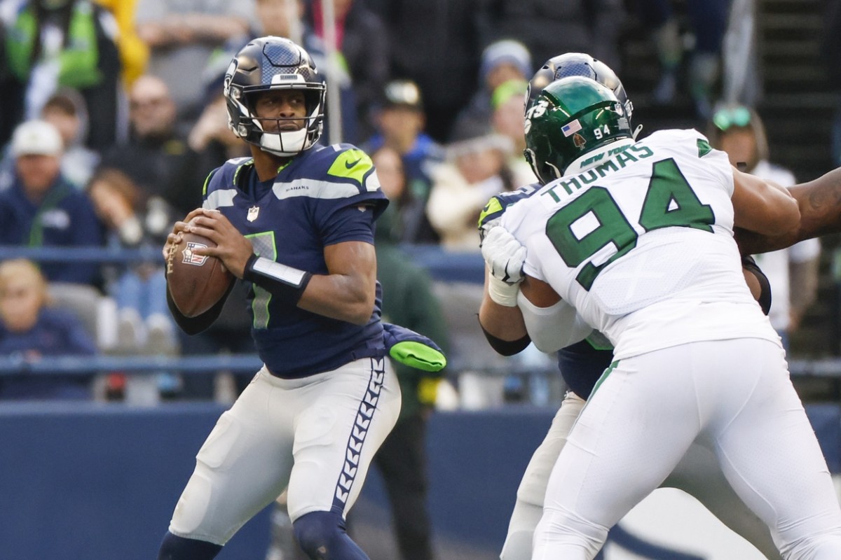 Jan 1, 2023; Seattle, Washington, USA; Seattle Seahawks quarterback Geno Smith (7) looks to pass against the New York Jets during the third quarter at Lumen Field.