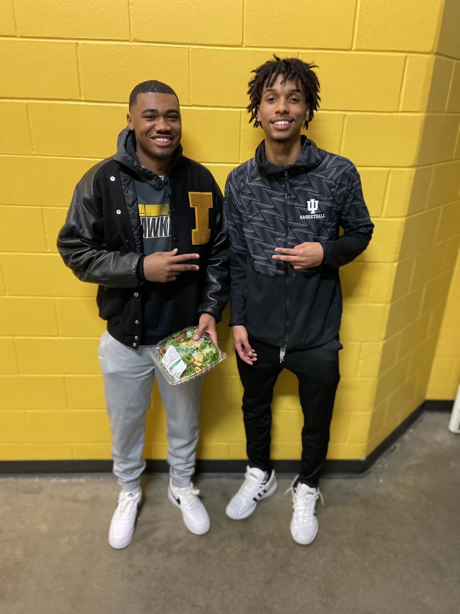 Iowa's Tony Perkins (left) and Indiana's CJ Gunn (right), high school teammates at Lawrence North, meet up after Thursday night's game at Carver-Hawkeye Arena in Iowa City, Iowa. Iowa defeated Indiana 91-89.