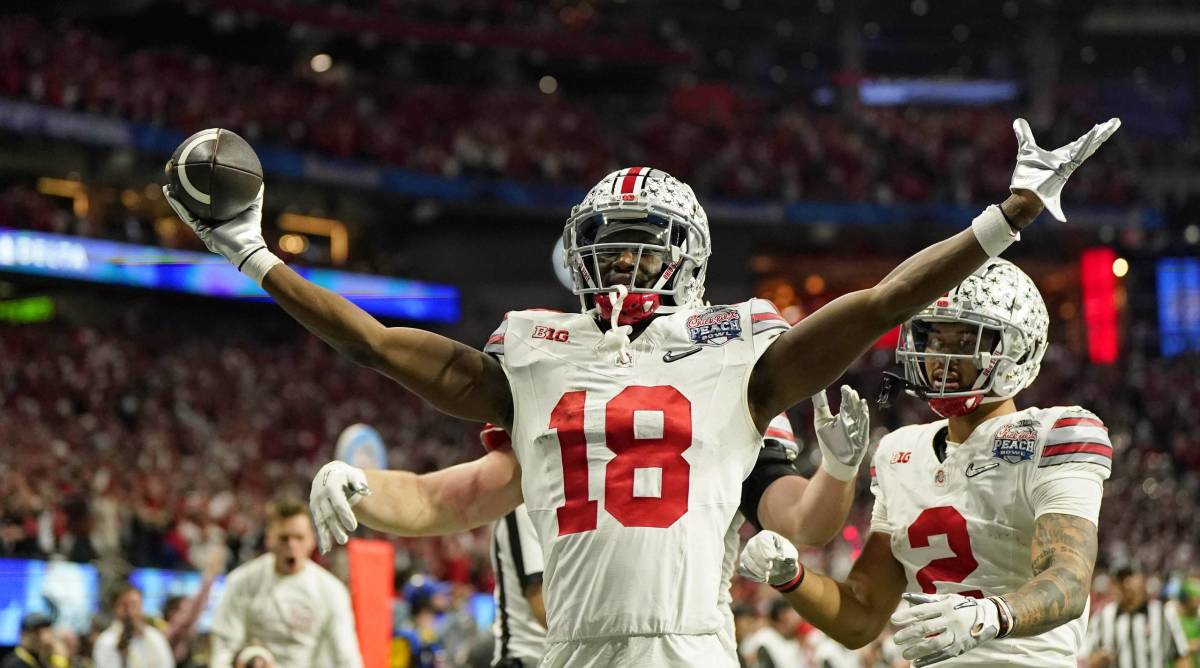 Ohio State wide receiver Marvin Harrison Jr. celebrates after scoring a touchdown vs. Georgia in the Peach Bowl.
