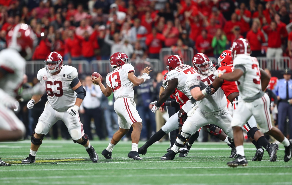 Alabama Crimson Tide quarterback Tua Tagovailoa (13) throws the game-winning touchdown pass to wide receiver DeVonta Smith (not pictured) in overtime against the Georgia Bulldogs in the 2018 CFP