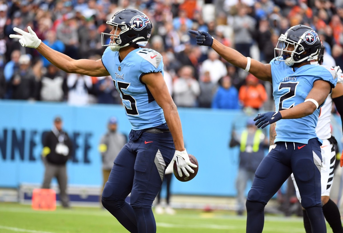 Tennessee Titans wide receiver Nick Westbrook-Ikhine (15) and wide receiver Robert Woods (2) celebrate after a first down during the first half against the Cincinnati Bengals at Nissan Stadium.
