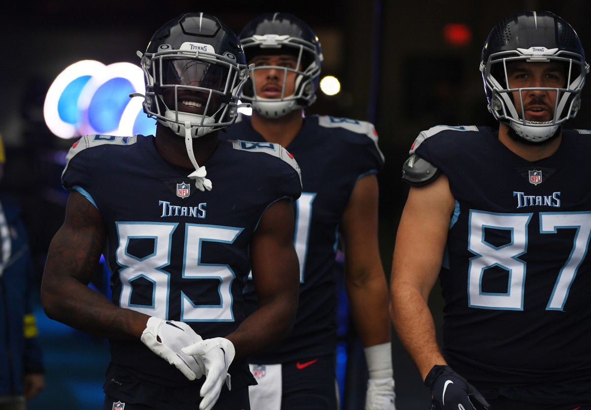 Tennessee Titans tight end Chigoziem Okonkwo (85) tight end Austin Hooper (81) an tight end Geoff Swaim (87) walk to the field before the game against the Jacksonville Jaguars at Nissan Stadium.