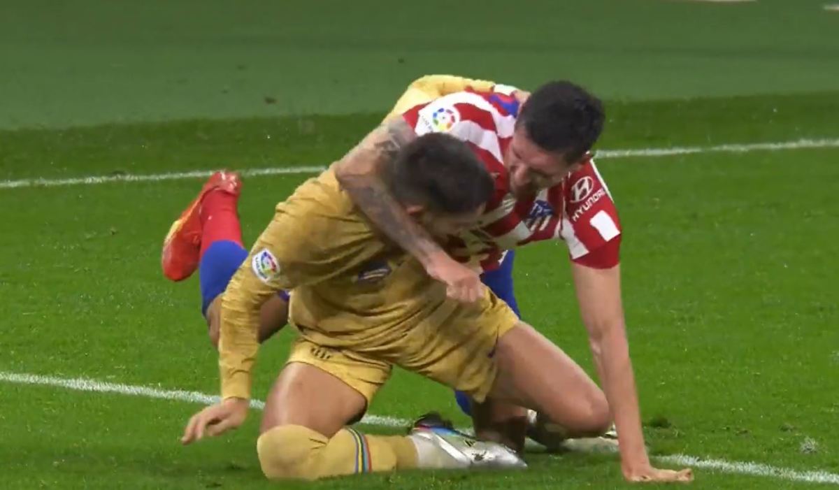 Ferran Torres (left) and Stefan Savic pictured wrestling during Barcelona's game at Atletico Madrid in January 2023