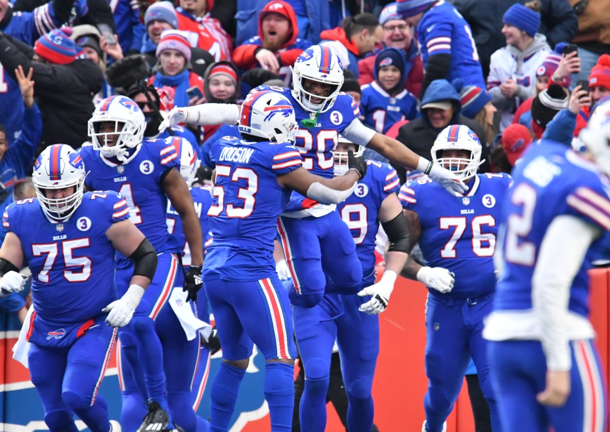 The Bills celebrate Nyheim Hines’s second kickoff return touchdown against the Patriots in Week 18.