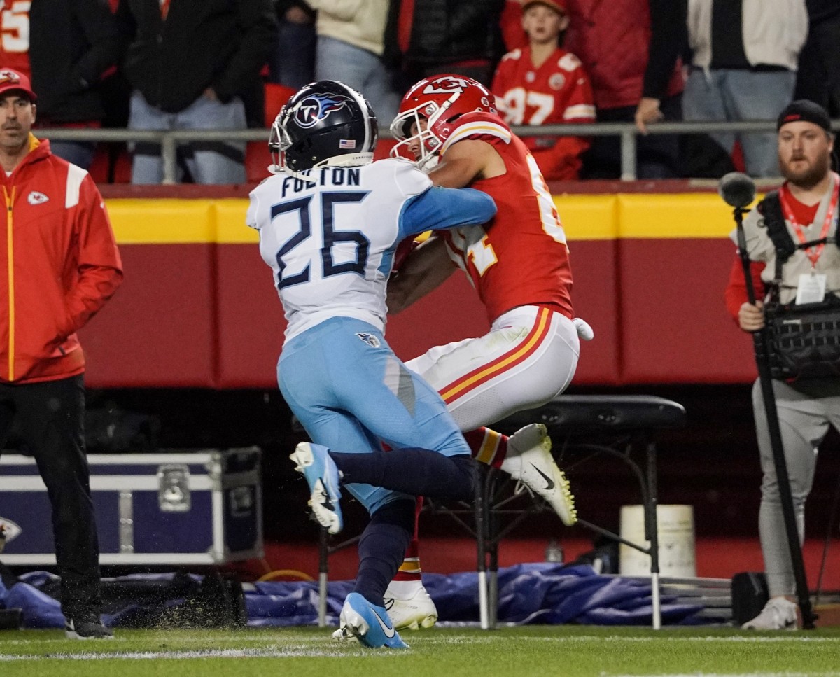 Kansas City Chiefs wide receiver Justin Watson (84) catches a pass as Tennessee Titans cornerback Kristian Fulton (26) defends during the first half of the game at GEHA Field at Arrowhead Stadium.