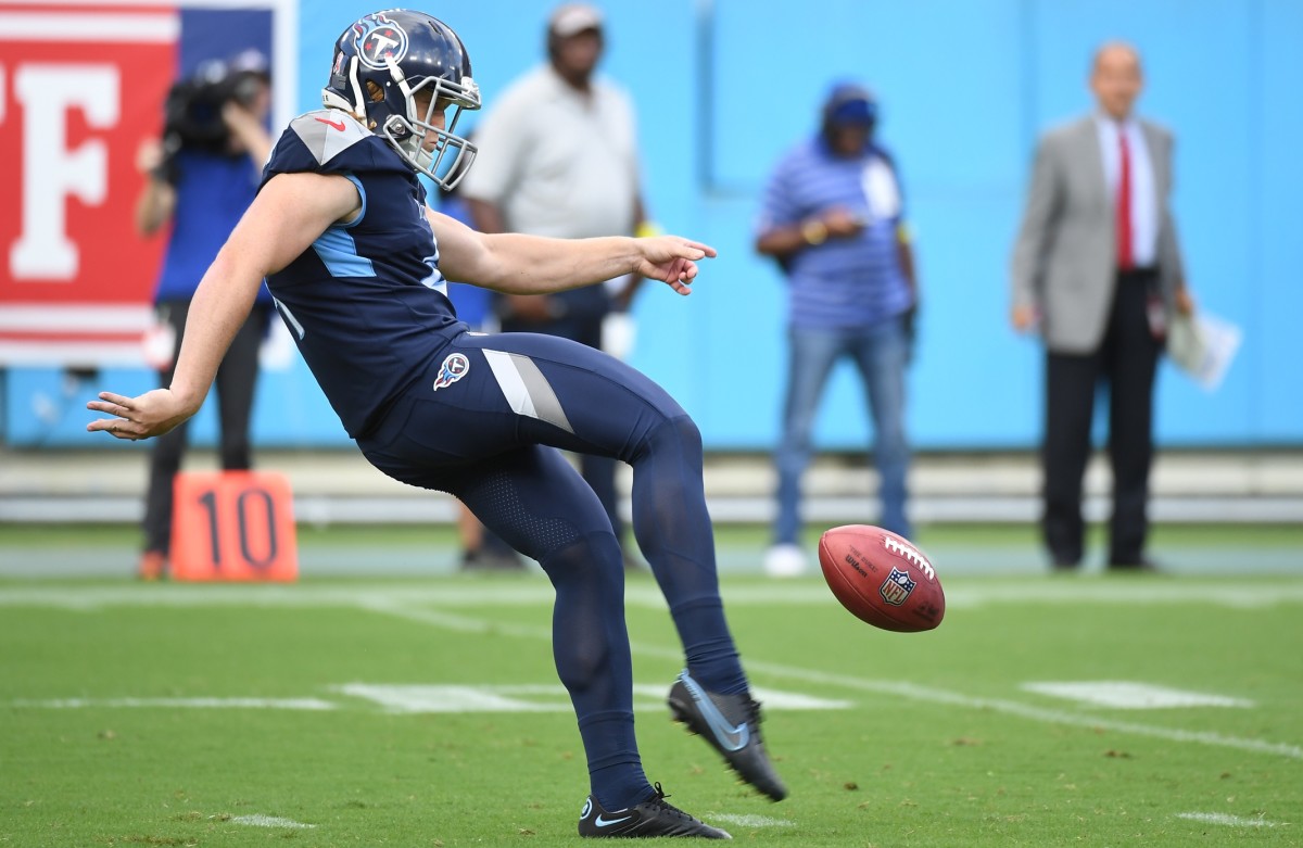 Tennessee Titans punter Ryan Stonehouse (4) punts the ball during the second half against the New York Giants at Nissan Stadium.