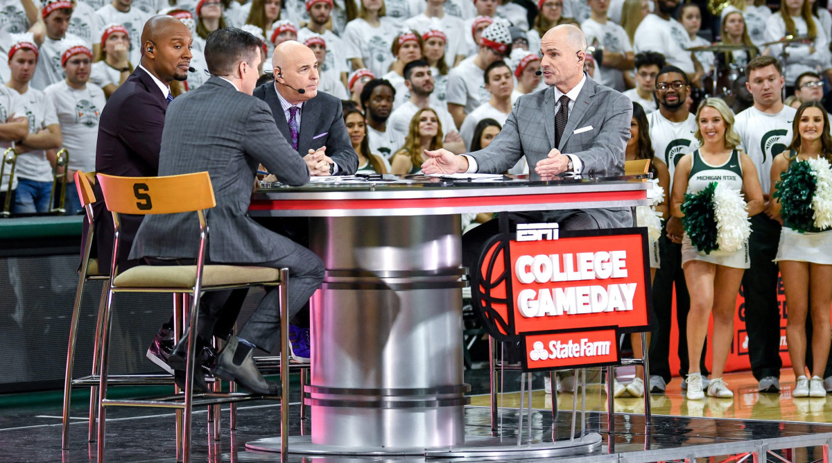 From left, hosts Rece Davis, LaPhonso Ellis, Seth Greenberg and Jay Bilas talk during a broadcast of ESPN college basketball