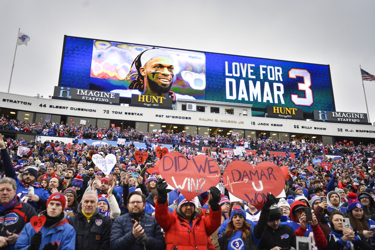 Bills fans hold up signs for Damar Hamlin during game against the Patriots
