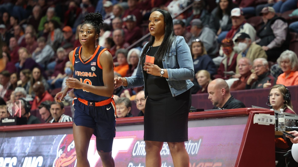 Mir McLean subs into the game as head coach Amaka Agugua-Hamilton looks on during the Virginia women's basketball game at Virginia Tech at Cassell Coliseum.