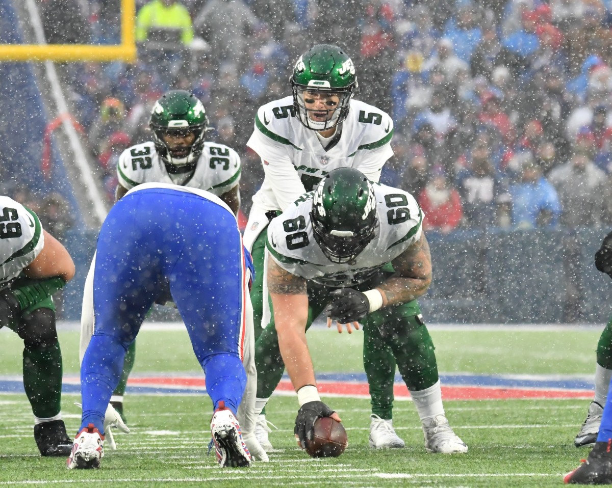 New York Jets C Connor McGovern snaps ball to QB Mike White