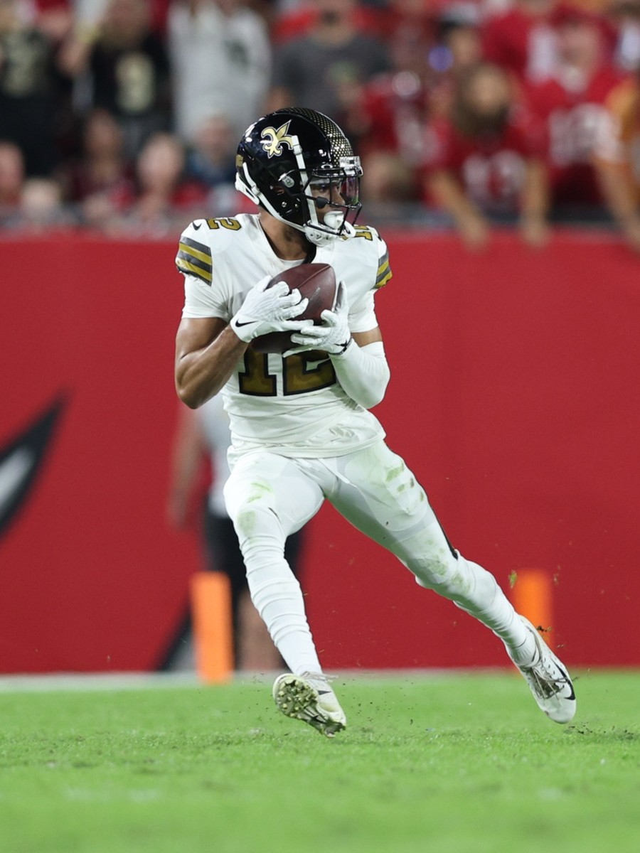 New Orleans Saints receiver Chris Olave (12) catches a pass against the Tampa Bay Buccaneers. Mandatory Credit: Nathan Ray Seebeck-USA TODAY Sports