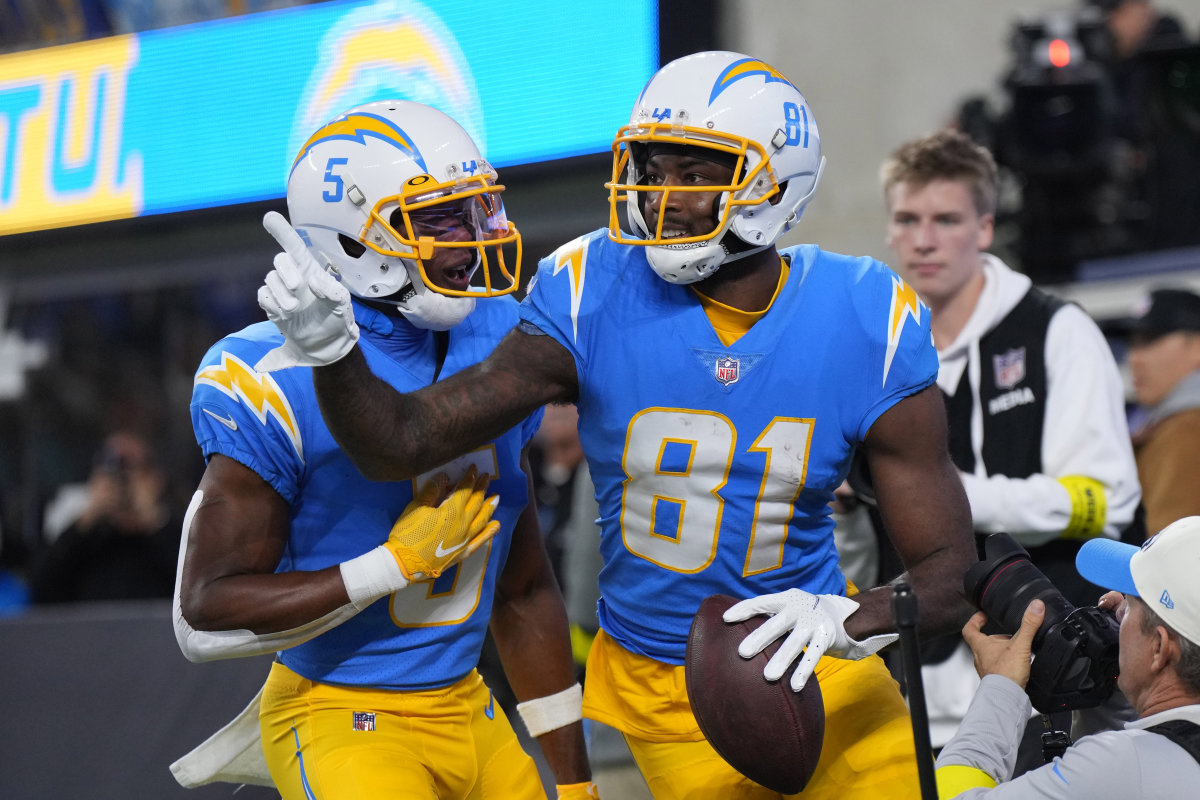 Dec 11, 2022; Inglewood, California, USA; Los Angeles Chargers wide receiver Mike Williams (81) celebrates with wide receiver Joshua Palmer (5) after catching a 10-yard touchdown pass in the first half against the Miami Dolphins at SoFi Stadium. Mandatory Credit: Kirby Lee-USA TODAY Sports