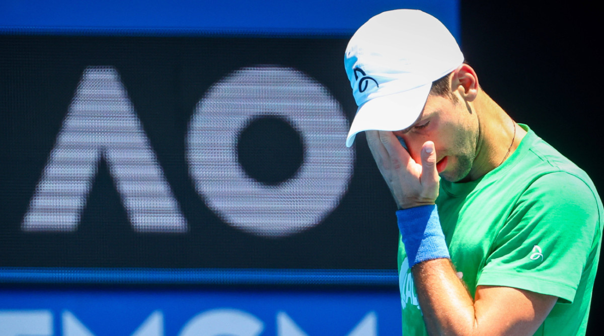 Novak Djokovic warms up ahead of the 2022 Australian Open.
