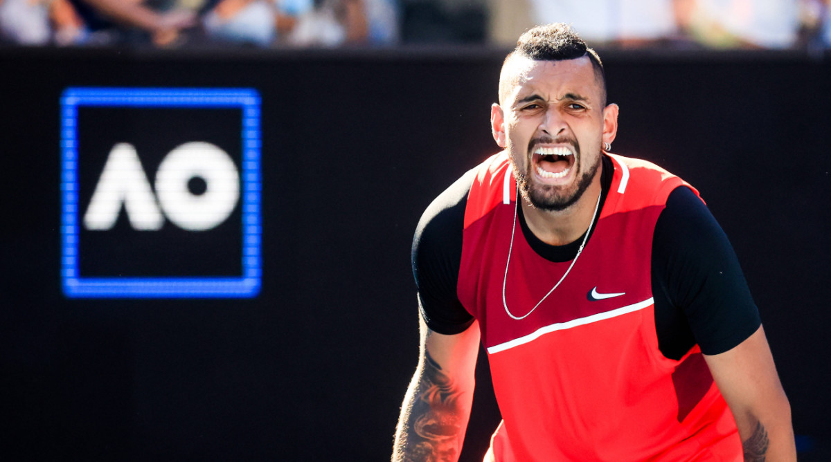 Australian tennis player Nick Kyrgios reacts to a point during a doubles match at the 2022 Australian Open.