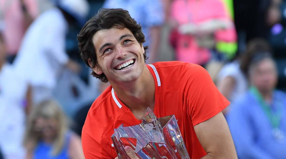 American tennis player Taylor Fritz smiles after winning the 2022 Indian Wells tournament.
