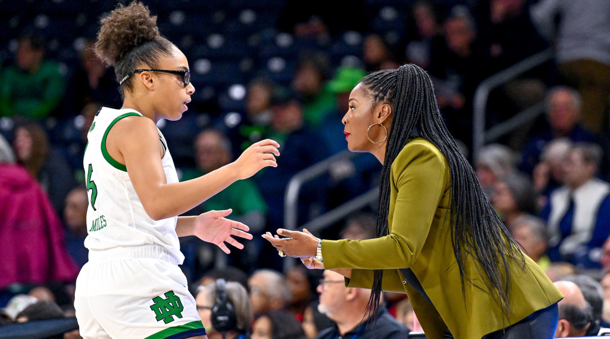 Notre Dame head coach Niele Ivey talks to guard Olivia Miles in the first half against the Maryland Terrapins.